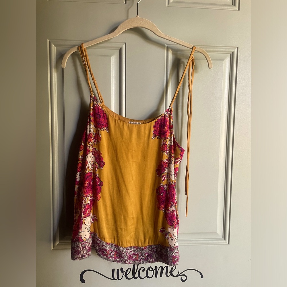 This is a fuchsia and mustard tank from Stitch Fix with beaded detail